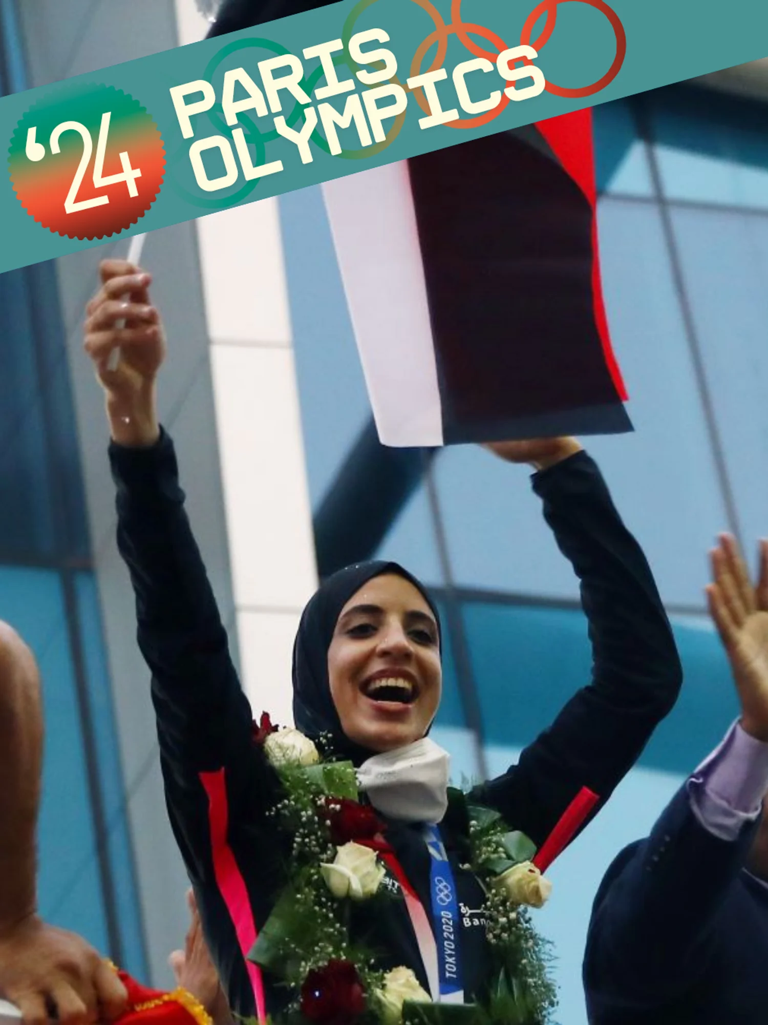 Egyptian karateka Feryal Abdelaziz 3rd R, who won the gold medal in women's +61kg Kumite at Tokyo 2020, is honored with cheers from Egyptian fans upon arrival at Cairo International Airport in Cairo, Egypt, on Aug. 12, 2021.
