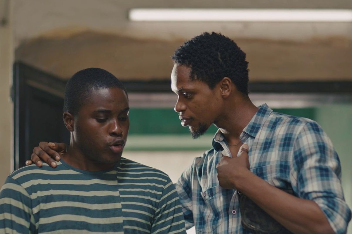 A film still of two “nwa boys” in the Nollywood movie “Áfàméfùnà: An Nwa-Boi Story,” standing side by side.