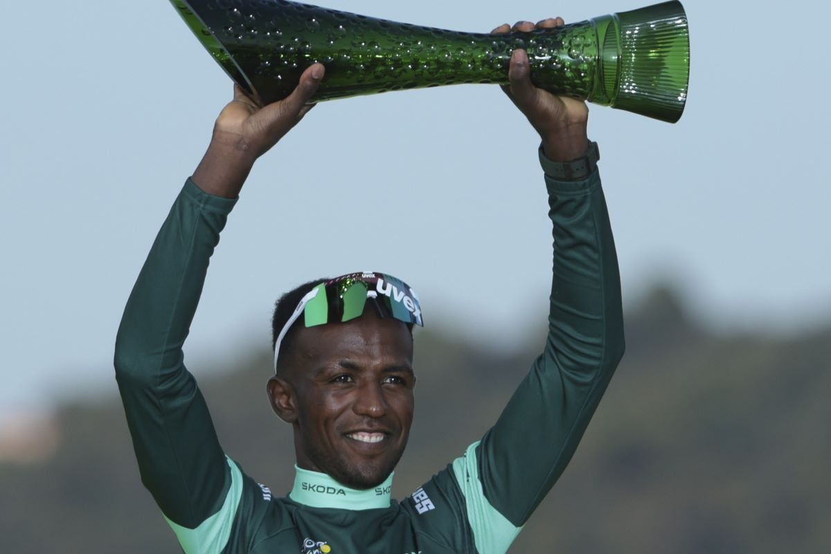 A photo of Biniam Girmay of Eritrea holding his green trophy as winner of the green jersey for best sprinter at the 111th Tour de France on July 21, 2024. 
