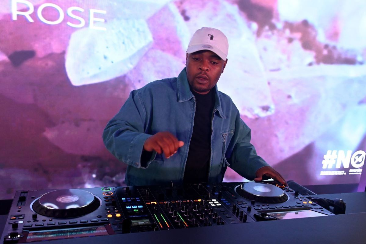 A photo of Tyler ICU performing with a DJ set.