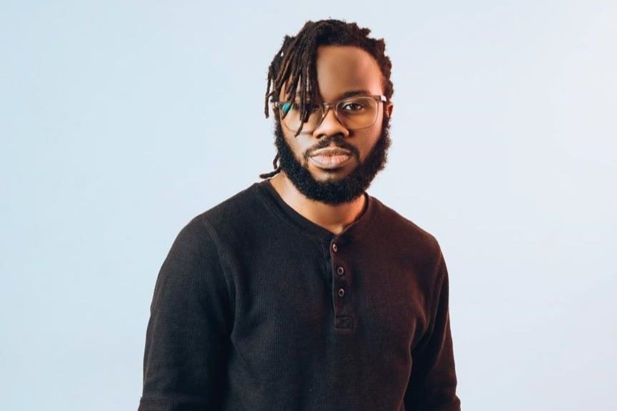 A portrait photo of Ebrahim Soul’o wearing an all-black look.
