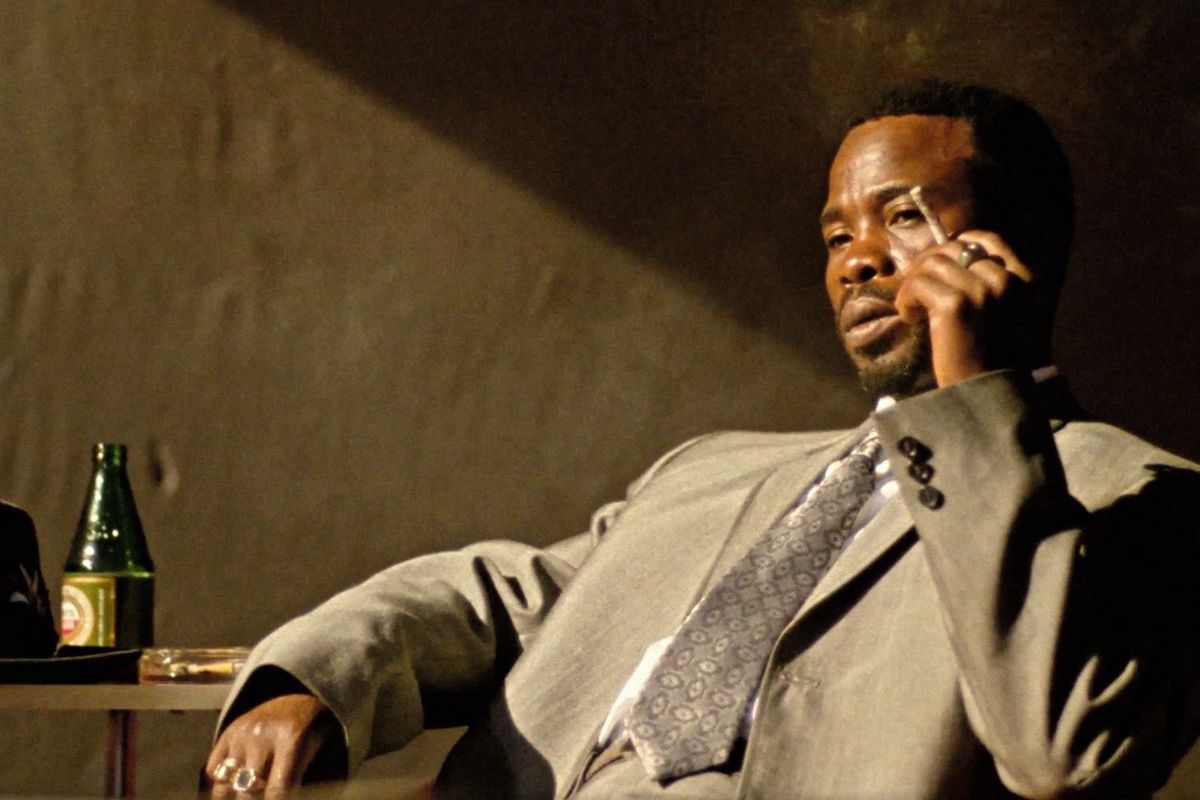 A still from the 4K-restored version of ‘Mapantsula' of a man smoking a cigarette and looking dejected.