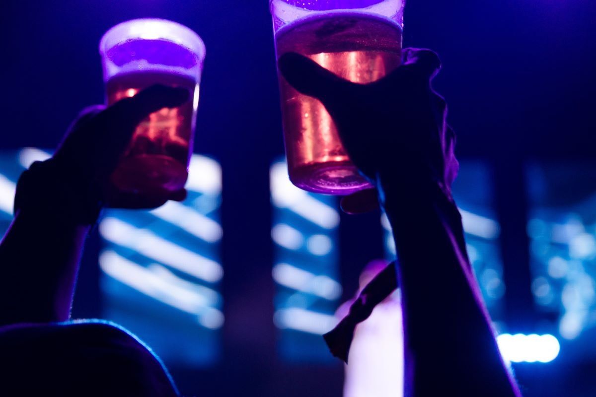 An image of beer glasses raised in the air.