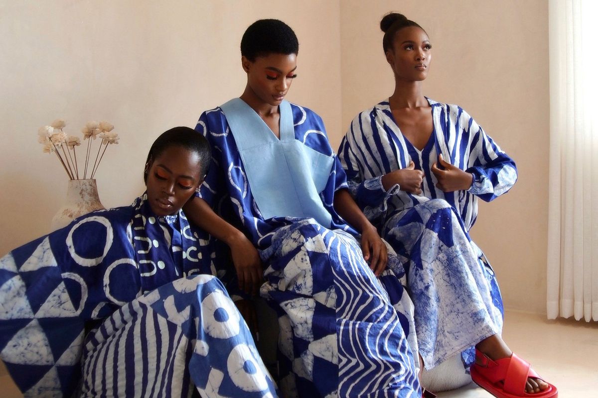 An image of three models wearing blue and white dyed clothing items. 