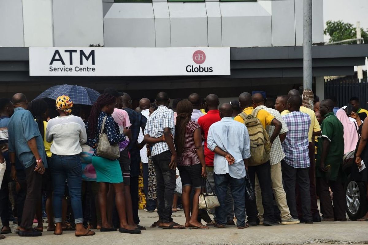 Dozens of Nigerians in a queue outside the bank.