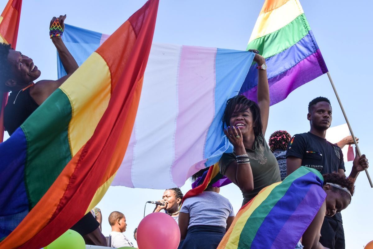 Dozens of people cheer and dance as they take part in the Namibian Lesbians, Gay, Bisexual and Transexual (LGBT) community pride Parade in the streets of the Namibian Capitol on July 29, 2017 in Windhoek.