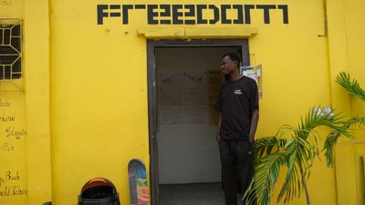 A skateboarder stands at the entrance of a room at the freedom skatepark in Accra