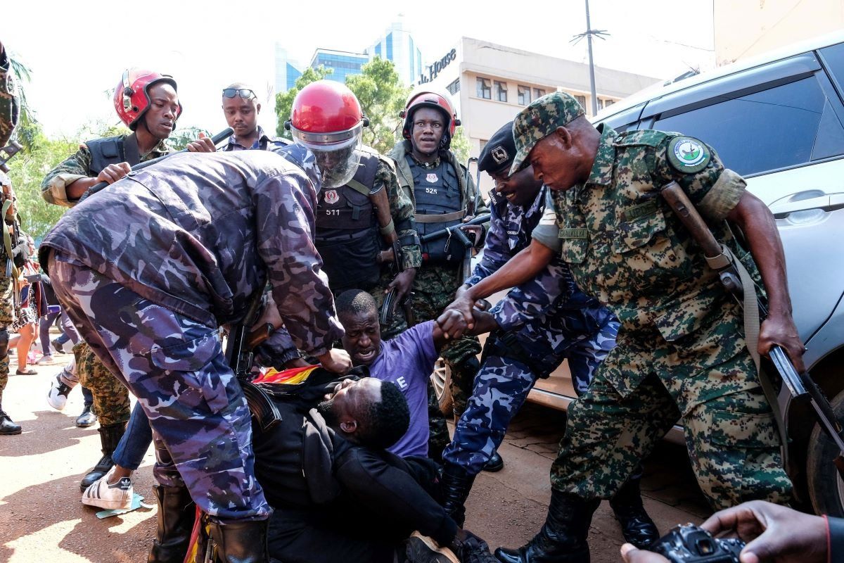 Military and police personnel arrest protesters during the anti-corruption protest in Kampala, the capital of Uganda, July 23, 2024.