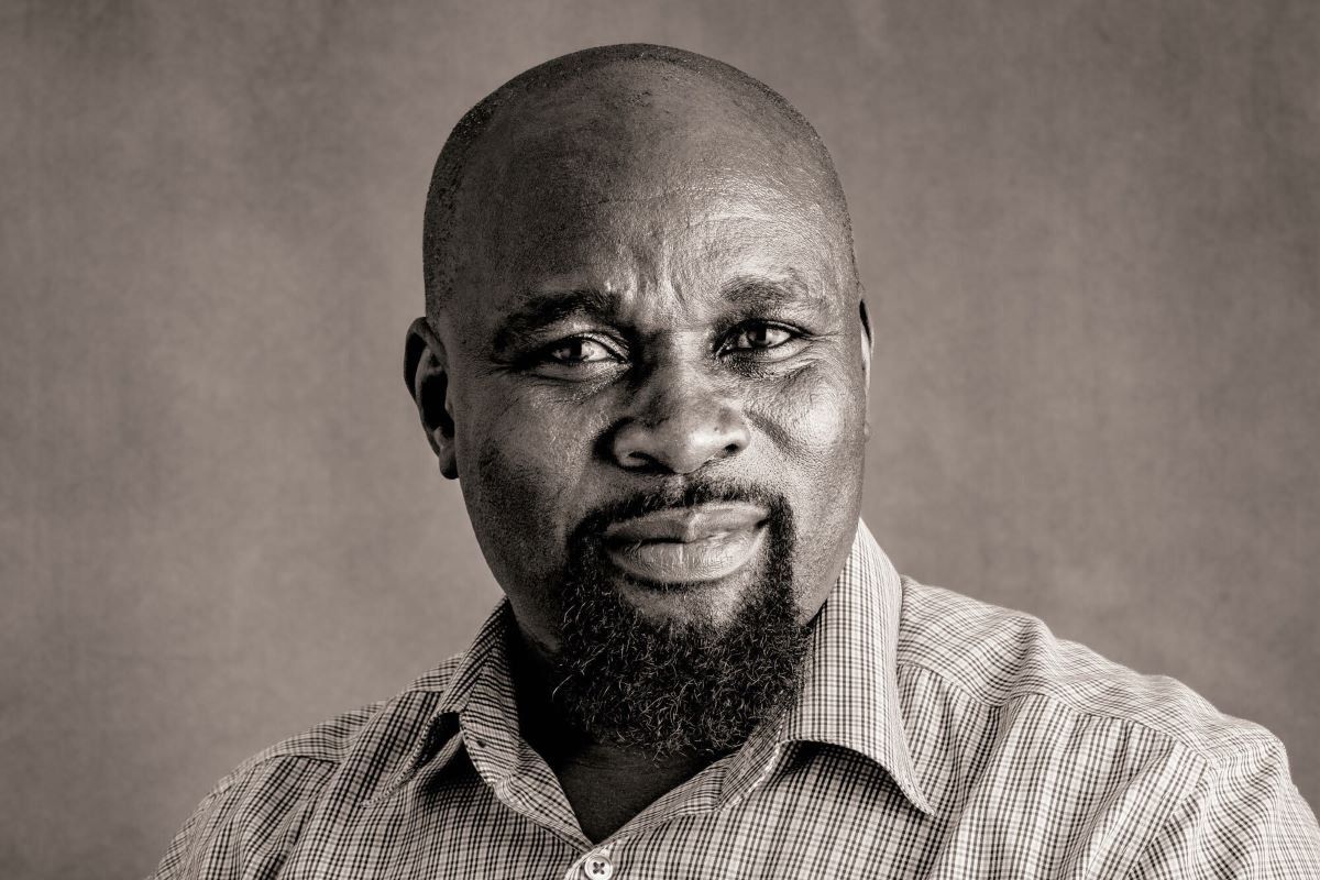 Uchenna Awoke stares forward at a camera with a slight smile.