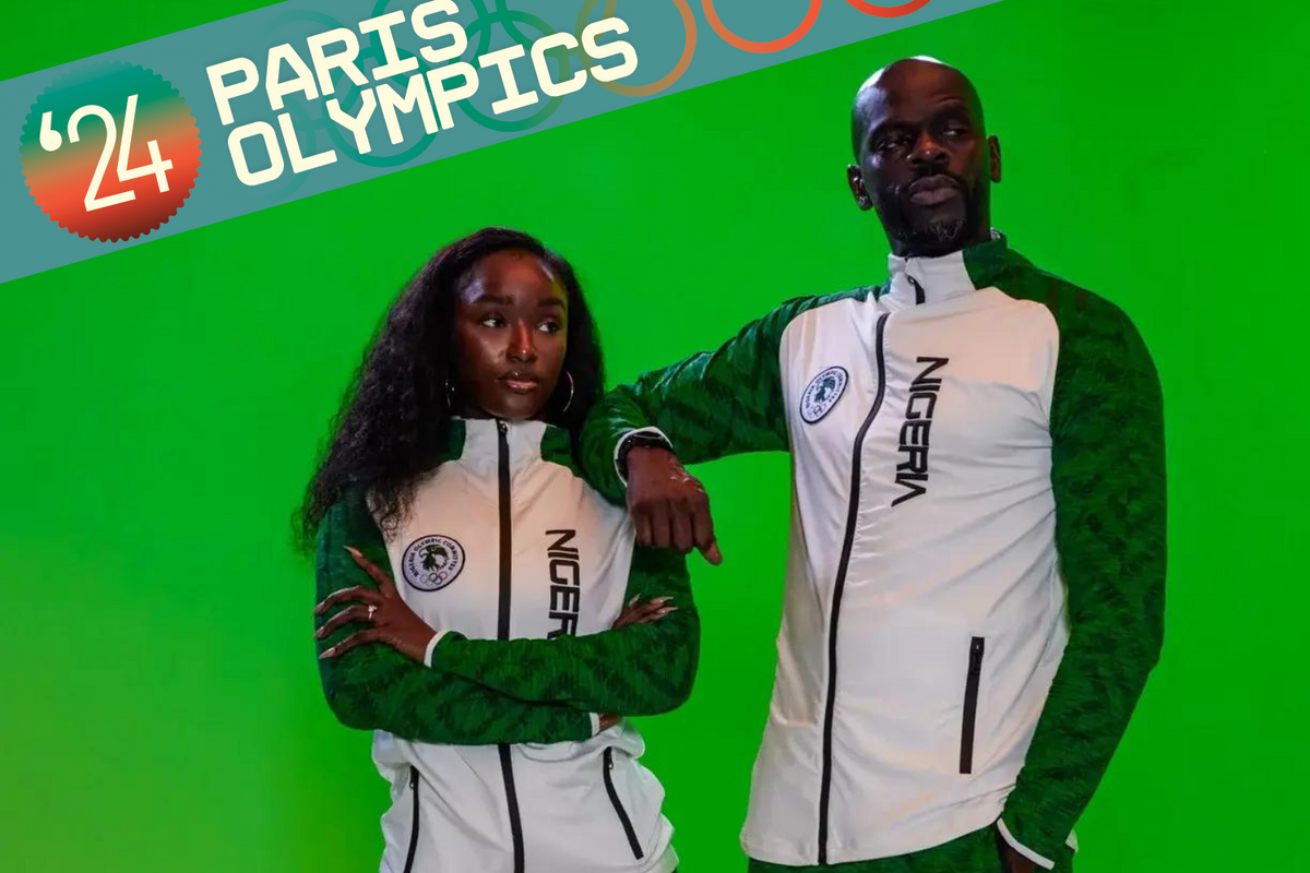 A photo of two models wearing the Nigerian 2024 Olympics white tracksuit with green sleeves, designed by Actively Black.