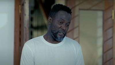 A still from ‘The Groomsmen’ showing Adjetey Anang in the frame.