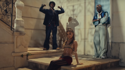 A still from the music video for ‘One Call’ showing Tyla, Omah Lay, and SPINALL.